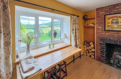 Corwen Cottage | Swan Cottage offers a relaxing space for all the family to enjoy.