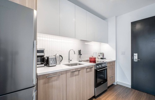 MIT Apartment | Gentle Kendall Sq Studio, Gym, Doorman, near MIT by Blueground