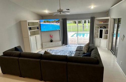 Lake Worth House | Golf course view & heated pool home
