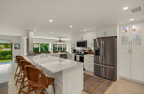 Shell Harbor House | Gorgeous canal front home walking distance to the beach!