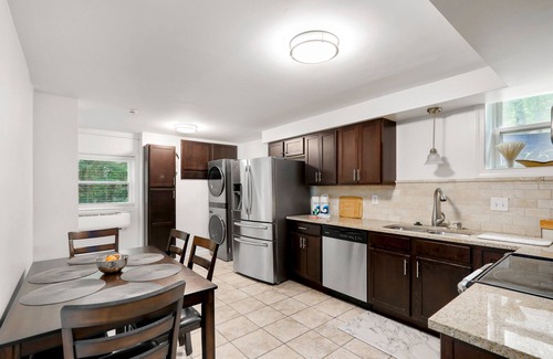 Heron Walk House | Gorgeous riverside guest house with firepit, patio - great location