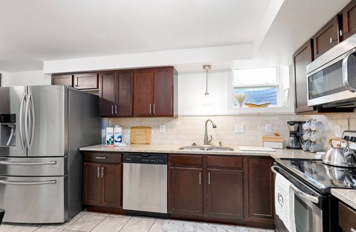 Heron Walk House | Gorgeous riverside guest house with firepit, patio - great location