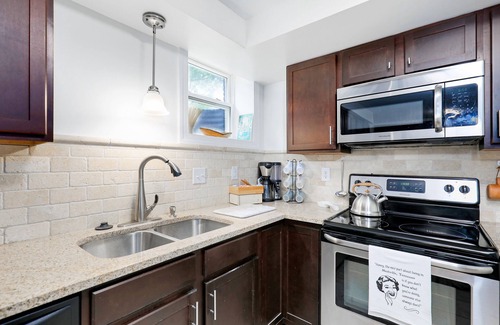 Heron Walk House | Gorgeous riverside guest house with firepit, patio - great location