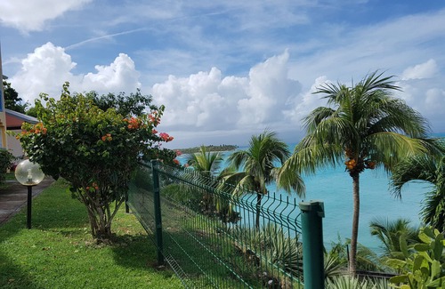 L'Houezel Apartment | Ground floor apartment with private patio courtyard. Sea view; Air conditioner;