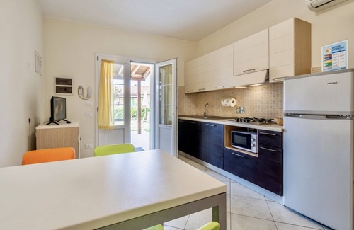 Vada Apartment | Ground floor apartment of 45 m2 with mosquito nets composed of a living room with satellite TV, cooking side, fridge with freezer, microwave oven and dishwasher.Double bedroom, two additional beds and bathroom.Air conditioning, clothesline.The apartment