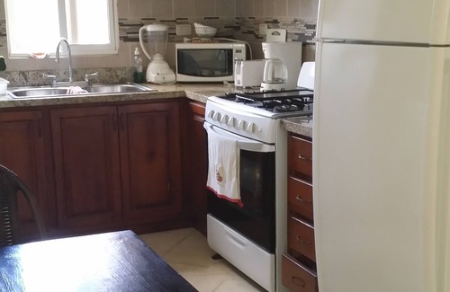 El Batey Apartment | Guest-friendly Apartment With Large Pool In Downtown Sosua, With WiFi, Cable TV