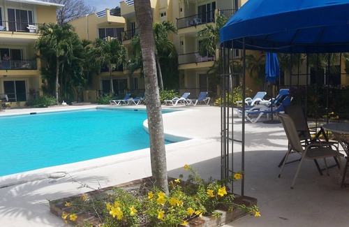 El Batey Apartment | Guest-friendly Apartment With Large Pool In Downtown Sosua, With WiFi, Cable TV
