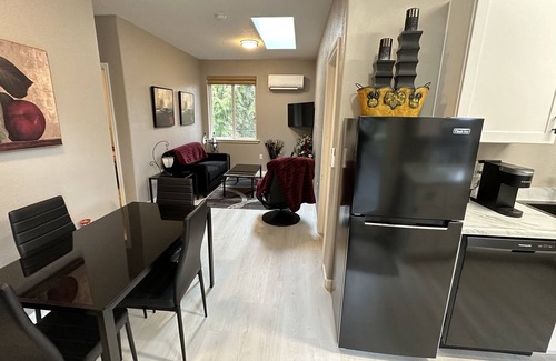 Meadow Glade Cottage | Guest House nestled in the trees with large deck, full kitchen, and laundry