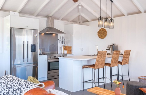 Palm Beach House | Gulf Island Views - Welcome to Gulf Island Views, a beautifully restored premium holiday cottage with incredible views of the Hauraki Gulf. With two bedrooms and one bathroom this is perfect for a family of four or two couples to share.