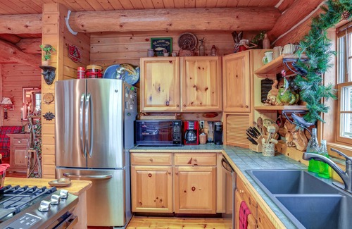 Thompsonville Cabin | Handcrafted Log Home on River Near Crystal Mtn