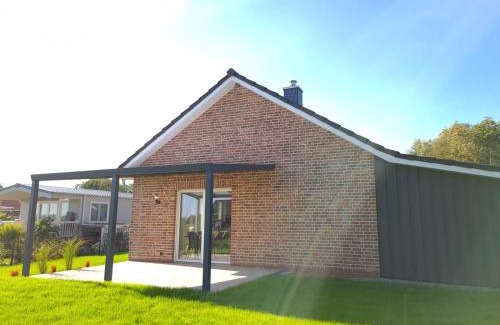 Sehestedt House | Haus KüstenBrise - Urlaub mit Hund an der Küste mit eigenen Garten, Sauna und gemütlichen Kaminfeuer