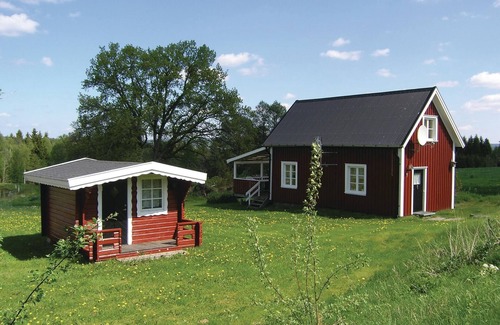 Dalstorp House | High situated cottage on a farm overlooking a pond with noble fish.