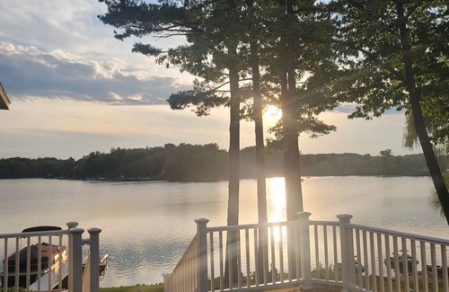 Krakow House | Highlights: Private beach just steps from your door Includes kayaks for exploring the lake Great fishing right off the shoreline or dock Bring your boat and enjoy full boating access Cozy indoor fireplace for cool evenings 4 spaciou