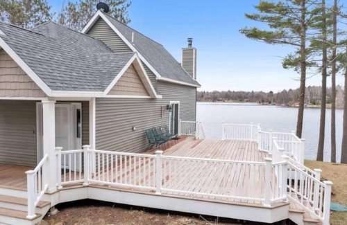 Krakow House | Highlights: Private beach just steps from your door Includes kayaks for exploring the lake Great fishing right off the shoreline or dock Bring your boat and enjoy full boating access Cozy indoor fireplace for cool evenings 4 spaciou