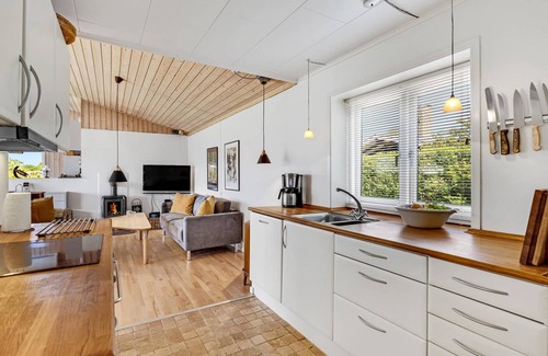Roskilde House | Highly furnished wooden house with wood-burning stove, fjord view and boat dock.