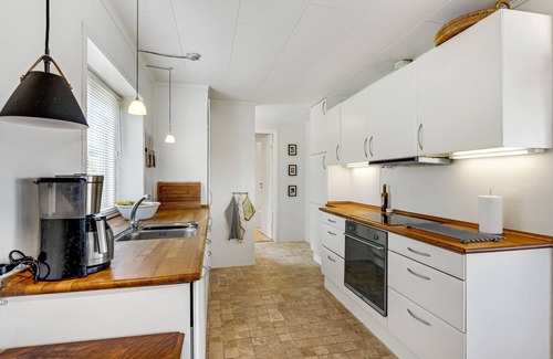 Roskilde House | Highly furnished wooden house with wood-burning stove, fjord view and boat dock.