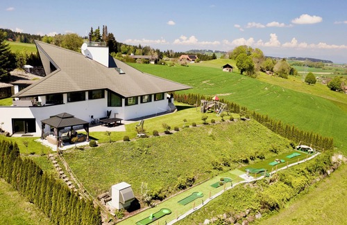 Riggisberg Villa | Hilltop Luxury Villa with Minigolf, Indoor Pool, Wellness & Spa