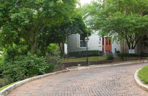 Burlington House | Historic home ideally located on famed Snake Alley, a one of a kind location.