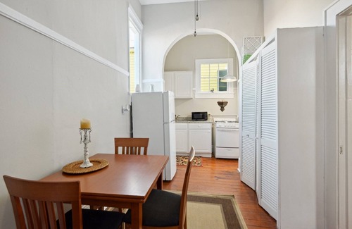 Seventh Ward Apartment | Historic Property With Balcony Lookout into Trees and Pre Civil War buildings.