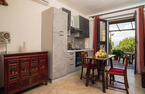 Castelmola Apartment | Holiday Apartment 'Garden Cottage I Dammusi - Arancio' with Mountain View, Shared Pool & Wi-Fi