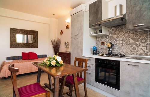 Castelmola Apartment | Holiday Apartment 'Garden Cottage I Dammusi - Arancio' with Mountain View, Shared Pool & Wi-Fi