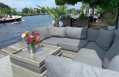 Municipality of Aalsmeer House | Holiday home at the water, fire place, boat and SUP rent, near Amsterdam
