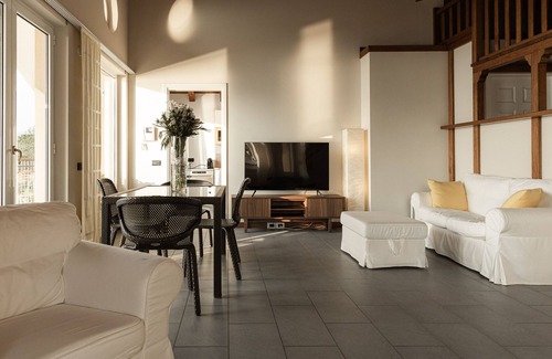 Reno House | Holiday Home 'Attico Borromea' with Lake View, Shared Pool and Wi-Fi