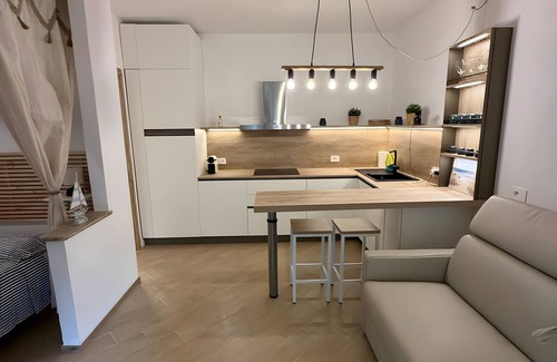 Porto Istana House | Holiday Home 'Le Vele' with Shared Pool, Private Garden and Air Conditioning