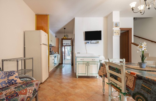 Porto Pino House | Holiday Home 'Sole E Mare' with Private Terrace, Private Garden and Air Conditioning