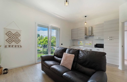 Arona House | Holiday Home 'Villa Lilia Appartamento Blu' with Shared Garden, Balcony and Wi-Fi