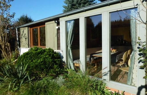 Weissig House | Holiday house with conservatory, fireplace and patio 'breakfast in the morning sun'