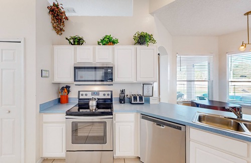 Westridge House | Home near Disney/golf with screened pool, spa, pool table, foosball, AC, & W/D