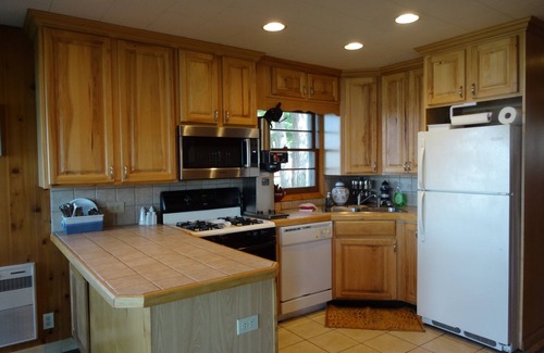Mears Cottage | Home on the lake. Walk out your door for Swimming, boating or morning coffee.
