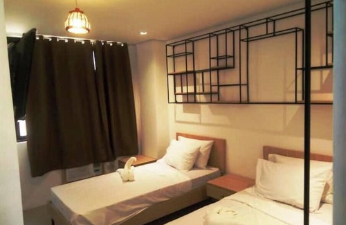 Baler Hotel | Hotel Rupert Atienza - Deluxe Room Twin Bed 1