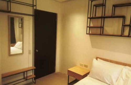 Baler Hotel | Hotel Rupert Atienza - Deluxe Room Twin Bed 1