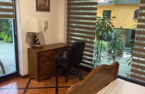 Puebla Villa | House among trees.