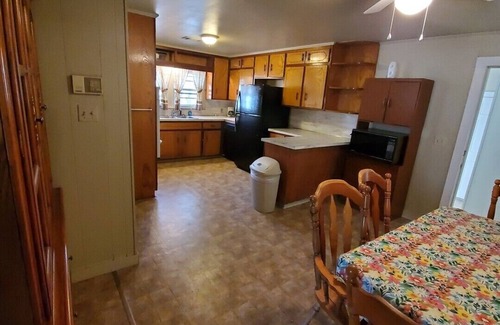 Malvern House | House with a full kitchen big backyard with trees