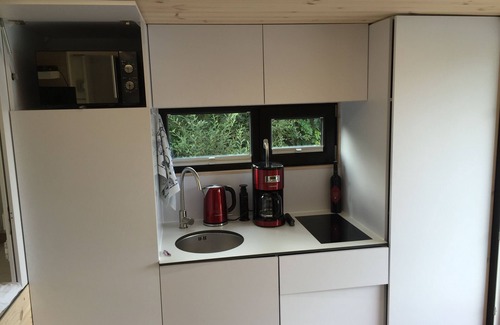 Rustersiel Boat Rental | Houseboat HT 5; with fireplace for 2-3 persons in an idyllic location of Wilhelmshaven