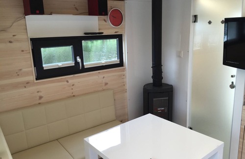 Rustersiel Boat Rental | Houseboat HT 5; with fireplace for 2-3 persons in an idyllic location of Wilhelmshaven