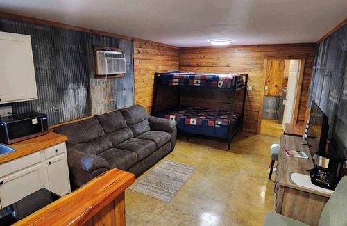 Fairbanks House | Hunters & Heroes Hideaway. Cozy barn studio in tranquil Loch Arbor area.