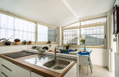 Carbonia House | Intimate, quiet studio apartment with a small living room and equipped kitchen