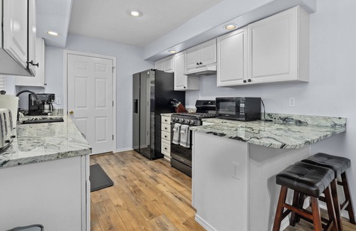 Keizer House | Inviting 2BR Half-Plex-Equipped Kitchen & Garage