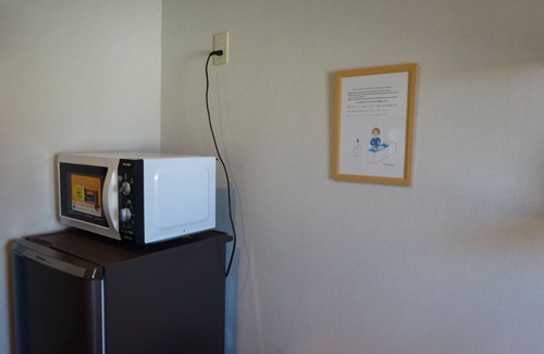 Ikuno Apartment | It has a kitchen, closet, shoe closet, washing machine, balcony and parking space. Clothes can be dried on the balcony, or room-dried. The 46 sq. m. of space is ideal for long-term stays.
