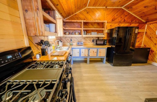 Northeast Somerset Cabin | Katahdin - Cabin 4 · Lawrence's Lakeside Cabins | 'Katahdin': Boat Dock + Kayaks
