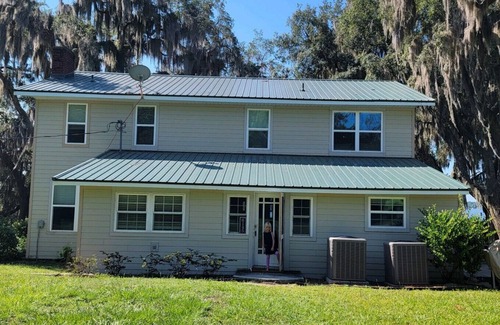 Starke House | Kingsley Lake Home w wide lawn, dock, central air, 4 kayaks. Near Camp Blanding