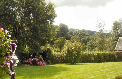 Saint-Denis-le-Gast Cottage | La Cachette stone detached gite in peaceful Normandy with own private garden