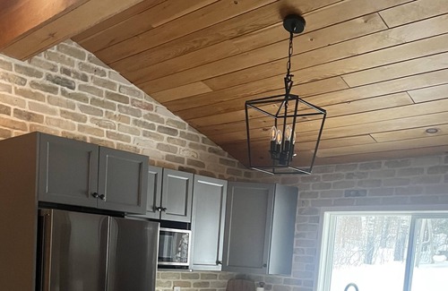 West Hawk Lake Cottage | Lakefront cottage with hottub and boathouse