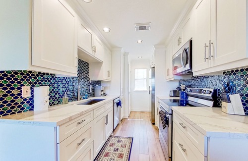 Walden on Lake Conroe Condo | Lakefront dog-friendly condo with lake views, pool, BBQ area, balcony, elevators