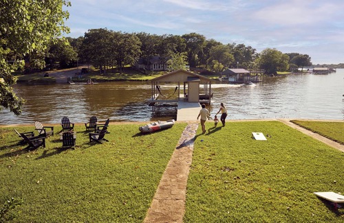 Enchanted Oaks House | Lakefront Getaway w/Boat Slip, Fire Pit & Outdoor Fun!