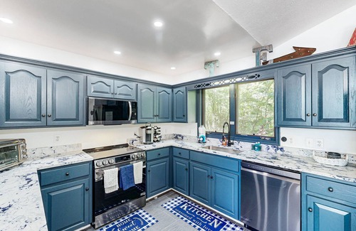 Bumpass House | Lakefront home with two kitchens, a dock, firepit, & pontoon